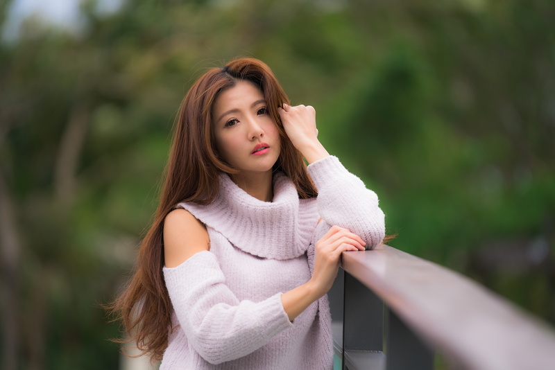 looking at viewer, 8K, brunette, depth of field, Asian, sweater, model, women, fence