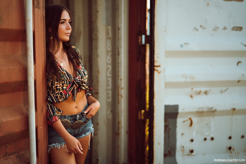 women outdoors, standing, leisure activity, looking, entrance, necklace, jean shorts, women, 1080P, hairstyle, contemplation, adult, lifestyles, indoors