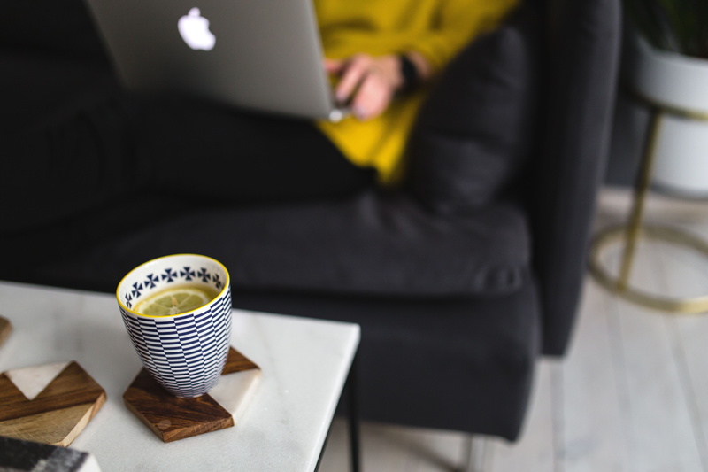 seat, computer, adult, person, wooden floor, caucasian, suit, drink, laptop, 5K, blogging, business, midsection, white, coffee, room, couch, coffee cup