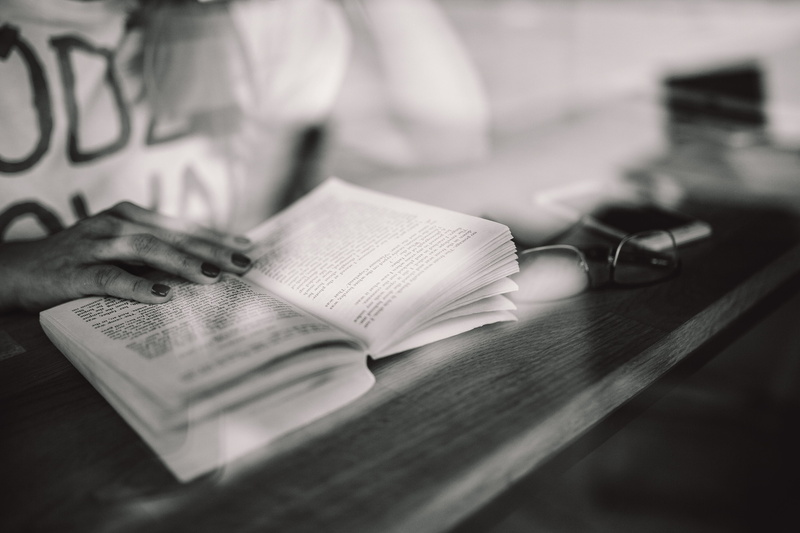 selective focus, black And White, woman, holding, cafe, table, hand, activity, human Hand, studying, indoors, shop, adults only, finance, Woman reading