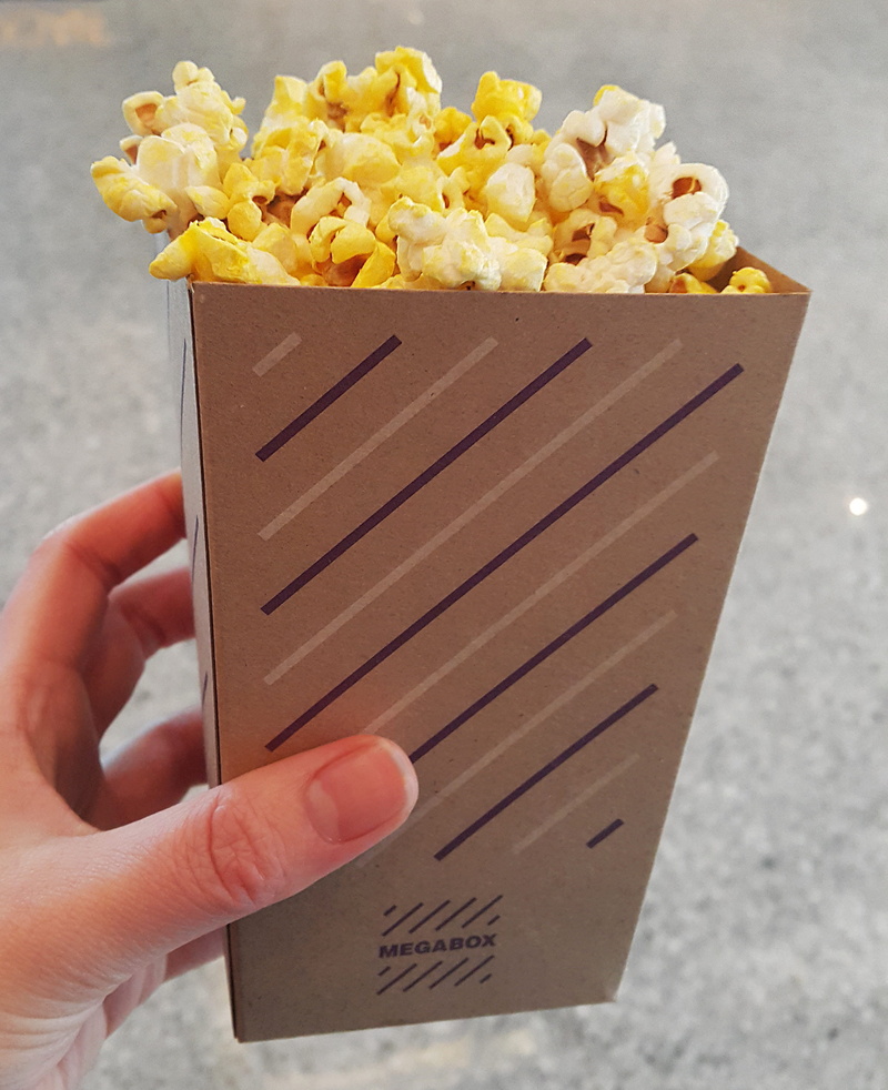 food, one person, Cinema, focus on foreground, outdoors, finger, 2K, day, personal perspective, unhealthy eating, flowering plant, plant, human finger