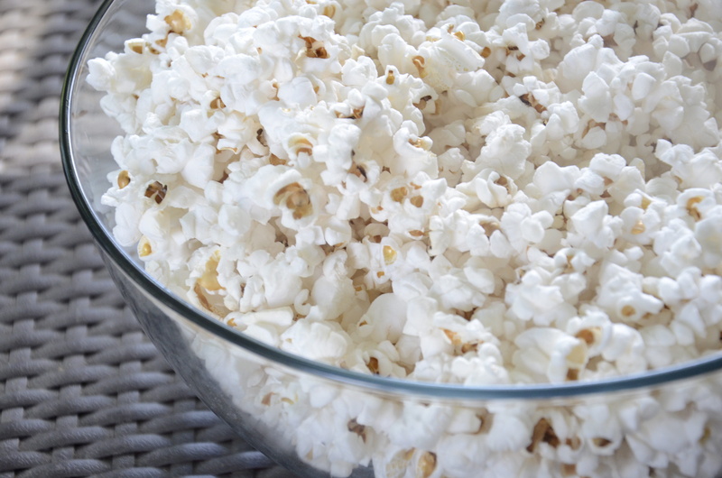 focus on foreground, white color, popcorn, clear, entertainment, tray, freshness, unhealthy eating, still life, temptation, cinema, high angle view, indulgence