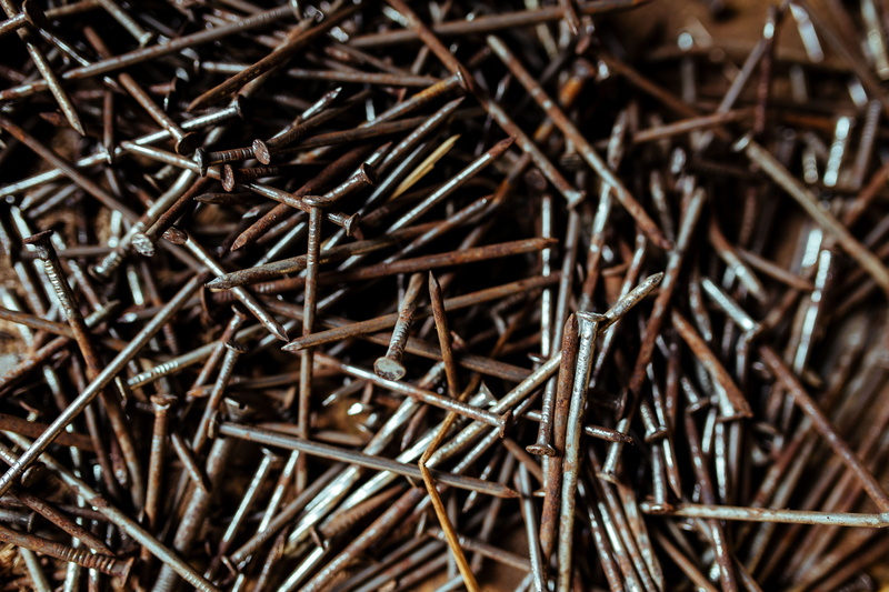 stick - plant part, nuts, brown, workshop, indoors, macro, dry, equipment, steel, nature, repair, rusty, full frame, selective focus, high angle view, still life