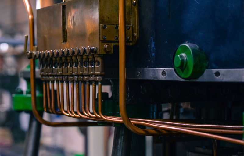 engine, no people, technology, steel, production, close-up, industry, factory, indoors, black color, green color, blue, side by side, machinery, machine