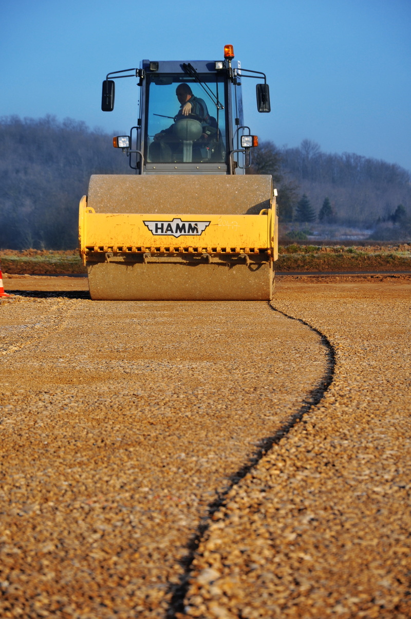 machinery, riding, road, construction equipment, vehicle Scoop, sky, no people, transportation, person, rural scene, agricultural machinery, day, roller