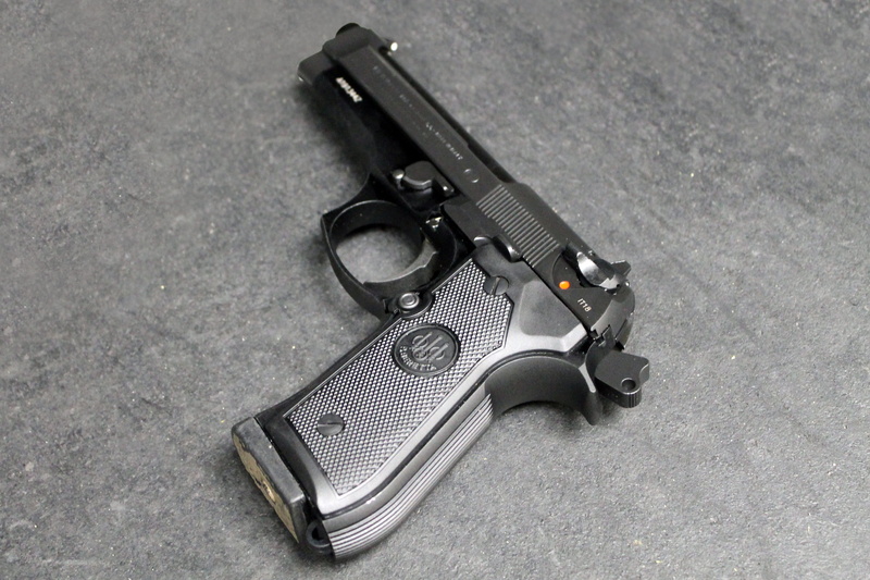 pistol, safety, beretta, high angle view, no people, still life, indoors, aggression, weapon, m9, social issues, black color, police force, protection