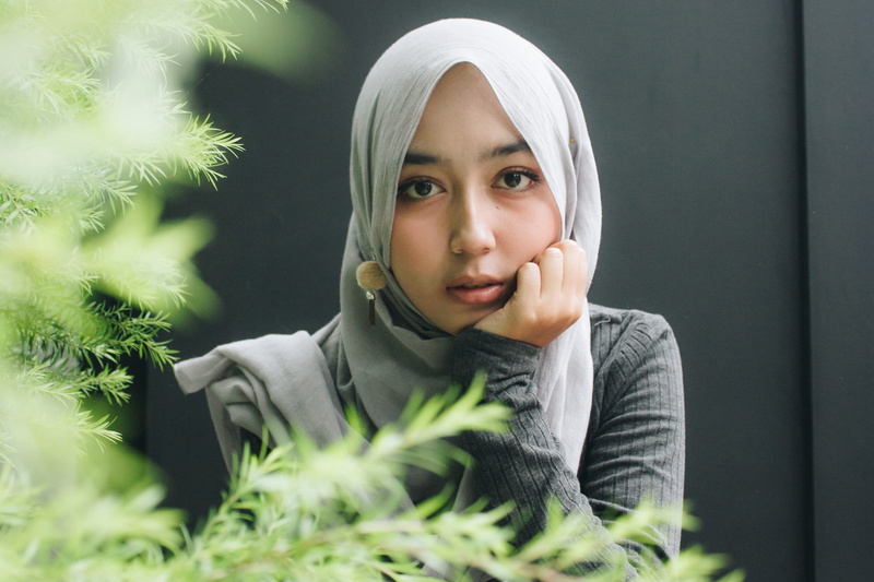 sleeved, face, one person, human, tree, apparel, finger, hijab, fashion, woman, person, top, cheek, clothing, childhood, front view, gray, long, female