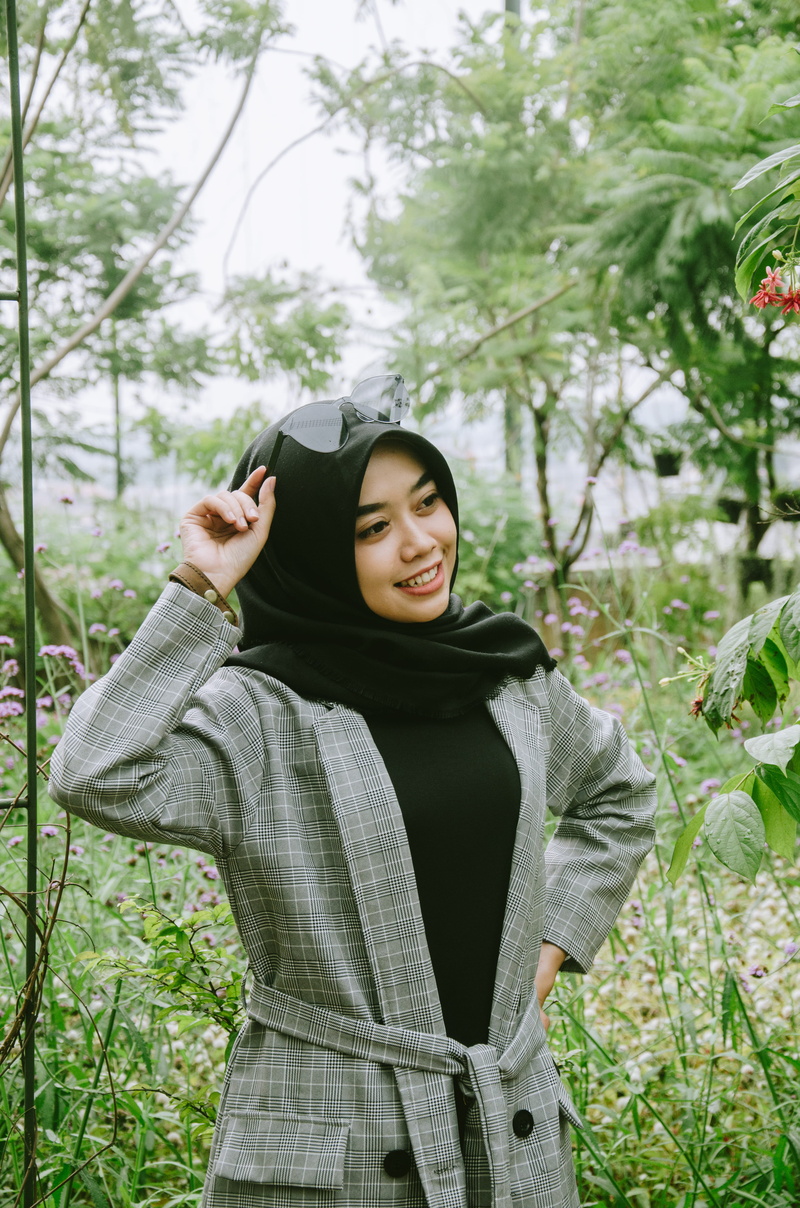 wearing, scarf, beautiful woman, nature, apparel, bandung, accessory, smiling, tree, black, plant, young adult, indonesia, front view, grey, holding, face