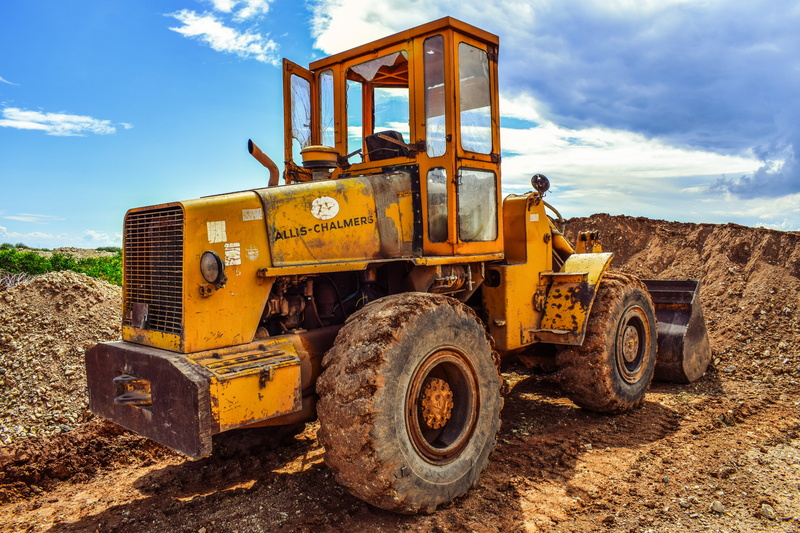 industry, yellow, day, nature, transportation, heavy machine, sky, construction vehicle, truck, dirt, road, wheel, equipment, outdoors, cloud - sky, working