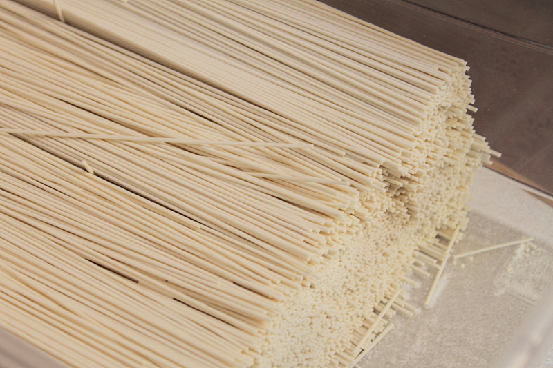 business, no people, wellbeing, spaghetti, noodles, food and drink, food, indoors, drying, close-up, freshness, still life, food processing plant, large group of objects