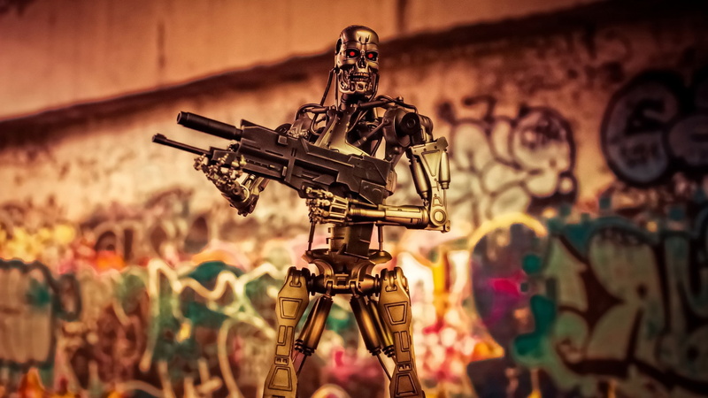 photography themes, graffiti, machinery, Terminator, wall - building feature, architecture, focus on foreground, no people, human representation, indoors