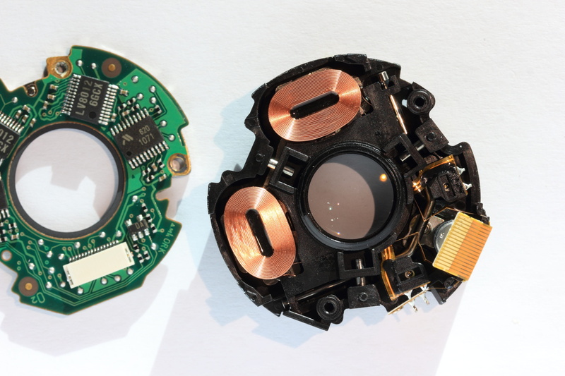 printed, table, is, magnetic, stabilization, shake, circuitry, actuator, directly above, camera film, mounted, black color, moving, pcb, eos, components