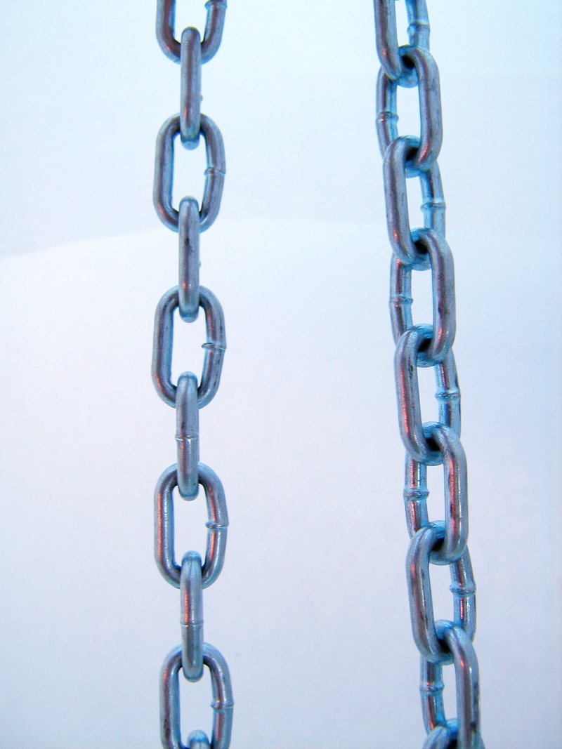 studio shot, metal, weakness, in a row, strength, steel, iron - metal, safety, backgrounds, metallic, communication, hanging, circle, durability, unity