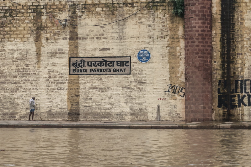 real people, full length, waterfront, day, western script, non-western script, bundi parkota ghat, communication, ghat, architecture, people, wall - building feature