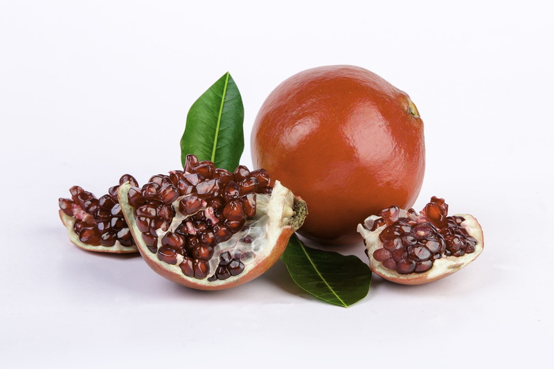 freshness, red, nature, studio shot, dried fruit, indoors, ripe, plant part, 4K, pomegranate, cut out, no people, close-up, white background, leaf, fruit
