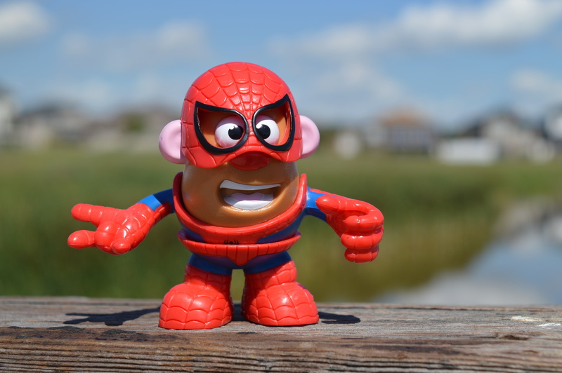 table, comic, mr, single object, toy, creativity, male likeness, childhood, focus, wood - material, water, human representation, focus on foreground, outdoors