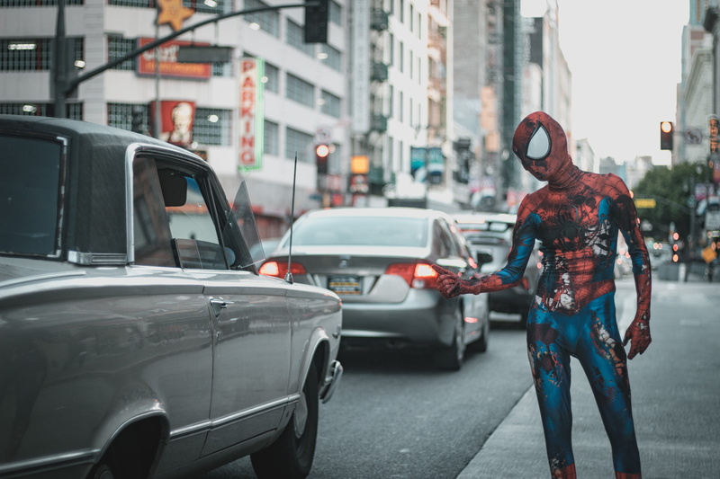 cosplay, wearing, street, 5K, costume, car, traffic, bicycle, man, men, land vehicle, standing, mode of transportation, comic book, city, spider, city life