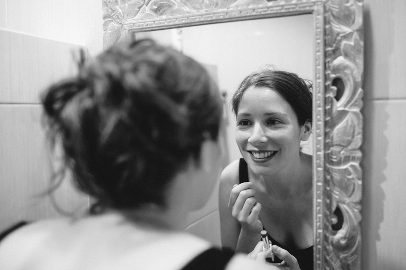 domestic bathroom, tuxedo, hairstyle, reflection, hair, indoors, make-up, clothing, veil, smiling, mirror, skin, room, female, applying, human, face, body care