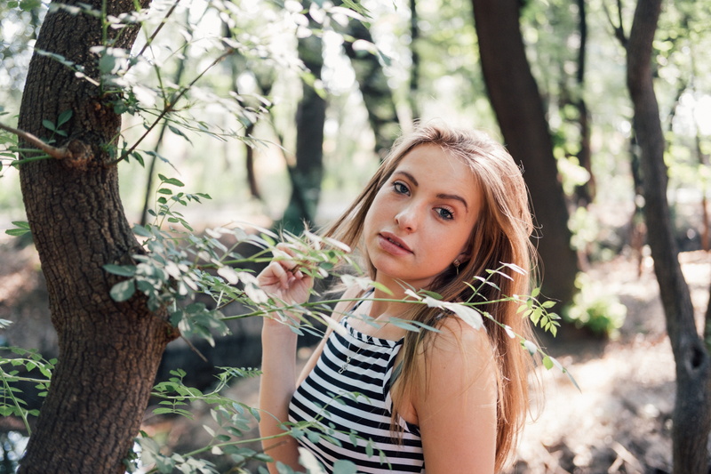 long hair, leisure activity, blonde, pottery, vase, black, strong, women, casual clothing, striped, hair, outdoors, adult, success, jar, female, potted plant