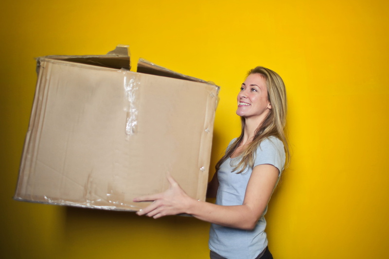 yellow background, wall, 2K, smiling, cheerful, positive emotion, hair, brown, hairstyle, box - container, young adult, Denim, long hair, inside, business