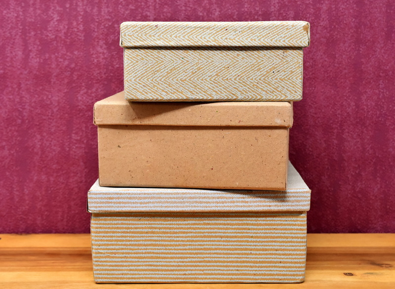 indoors, brown, container, cardboard boxes, cardboard, wood - material, order, paper, box, box - container, copy space, still life, wood, balance, toy