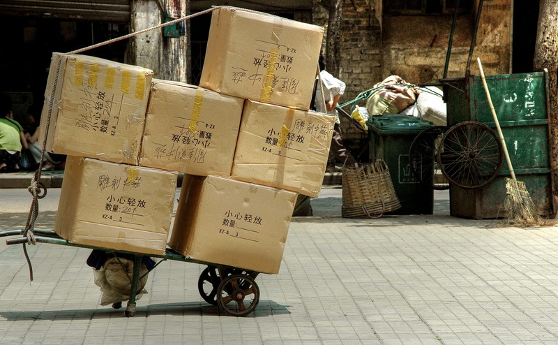 communication, cardboard, no people, footpath, box, cart, industry, China, street, city, large group of objects, incidental people, architecture, cardboard box