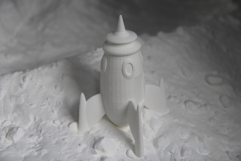 high angle view, no people, still life, printing, toilet paper, animal, indoors, nature, 3d, sand, selective focus, toy, elegance, table, container, rocket