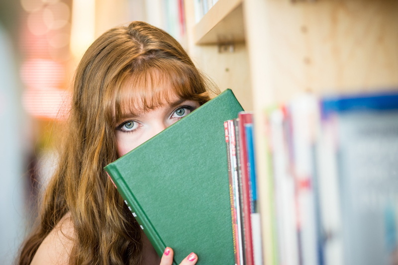 headshot, women, model, education, indoors, young adult, selective focus, bookshelf, close-up, learning, hiding, publication, books, bangs, hairstyle, teenager