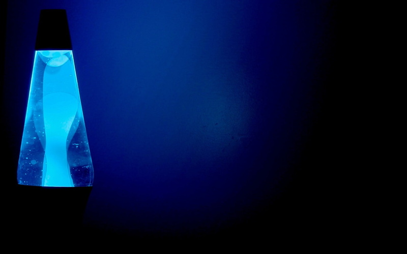 studio shot, lighting equipment, colored background, transparent, bottle, lava lamp, electricity, black background, illuminated, blue background, indoors