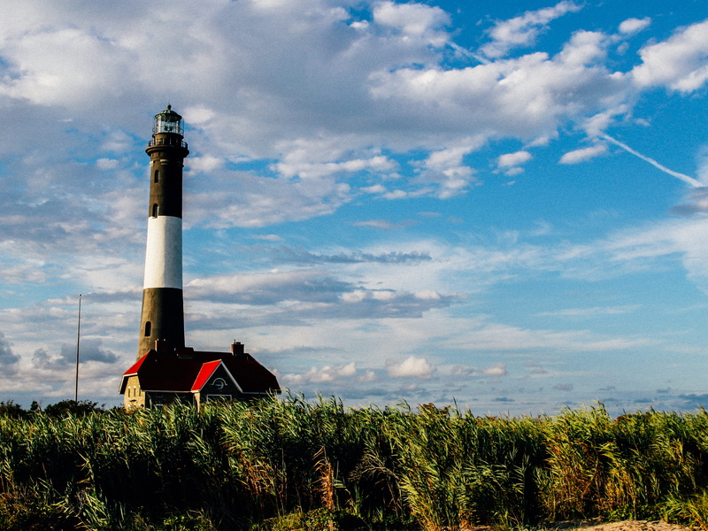 lighthouse, architecture, new york, building exterior, fire island, outdoors, day, land, united states, field, east coast, sky, security, nature, guidance