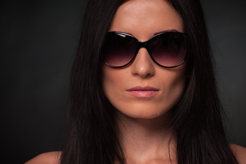 woman, body part, black hair, glamour, black background, one person, portrait, human face, beautiful people, wearing, black, sunglasses, person, leather