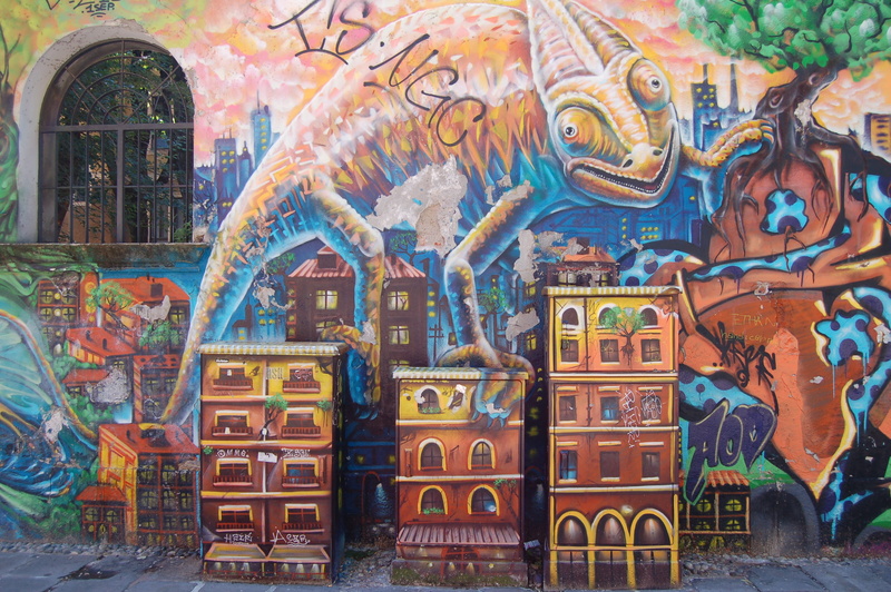 built structure, outdoors, building, 2K, buildings, wall street art in a public place, wall, building exterior, tall, oversized, representation, no people