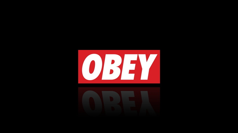 no people, text, studio shot, western script, black background, white color, sign, indoors, red, night, information sign, obey, light - natural phenomenon