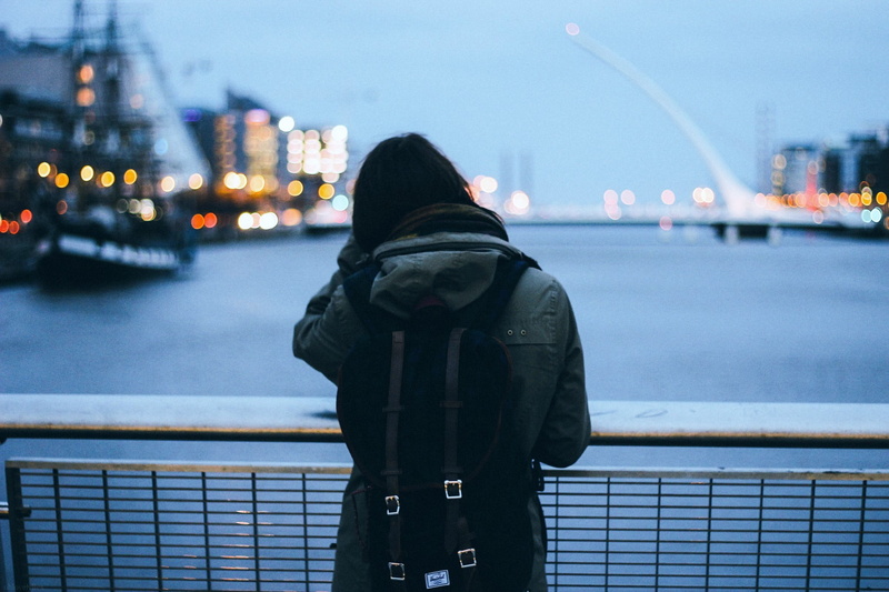 standing, street, lifestyles, illuminated, city Life, tourist, adult, s, black Color, cityscape, backpacks, hood - clothing, river, jacket, city, women