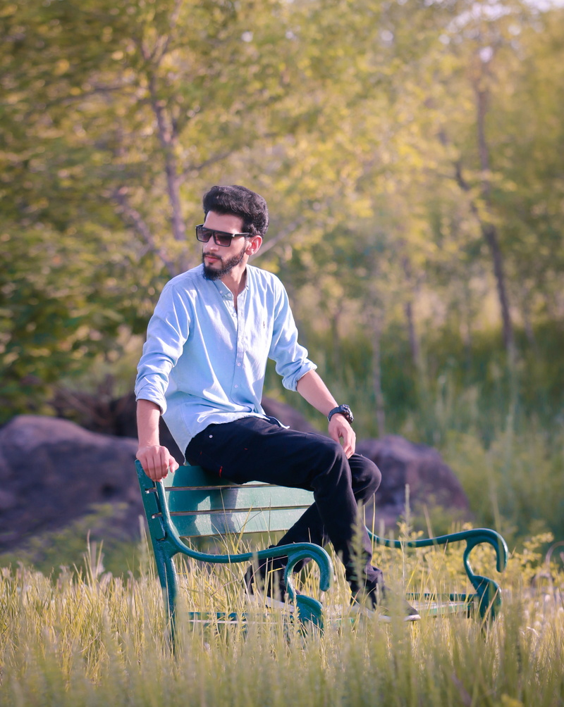 casual clothing, male model, hair style, cap, land, look, sitting, nature, young men, 4K, grass, lifestyles, outdoors, plant, young adult, pose, leisure activity