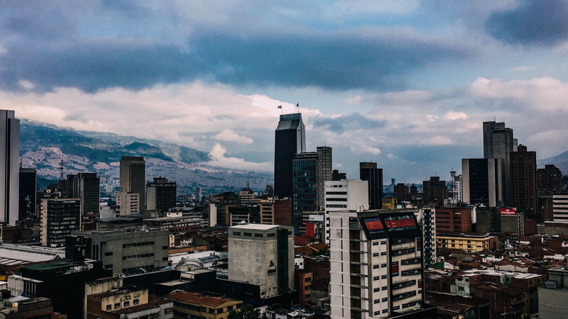 2K, office building exterior, day, blue, tall - high, tower, city, spire, crowded, colombia, financial district, medellin, crowd, green, high angle view