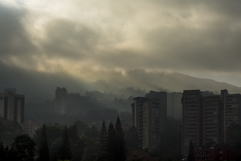 tree, residential district, medellin colombia, 5K, sky, very cloudy, fog, creepy, office building exterior, sunrise, dark sky, apartment, poblado medellin