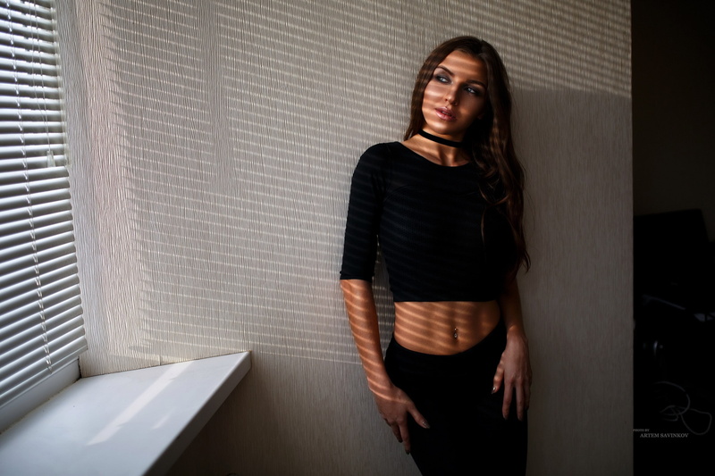 Artem Savinkov, black clothing, shadow, portrait, pierced navel, window, 2K, women, choker, belly, Yanina Vorozheikina, looking away