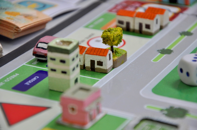 table, car, male likeness, large group of objects, small, creativity, no people, craft, green color, representation, figurine, indoors, toy, human representation
