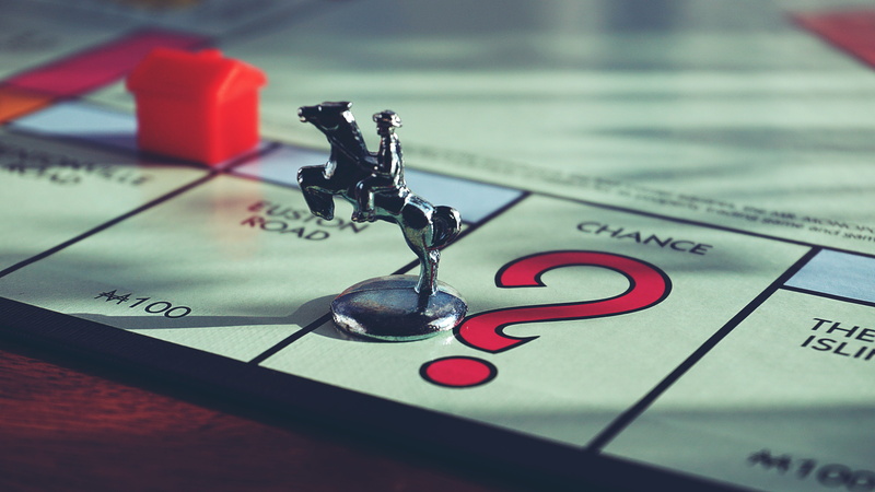 blur, western script, finance, focus on foreground, monopoly, writing instrument, no people, gray, indoors, close-up, business, economy, single object