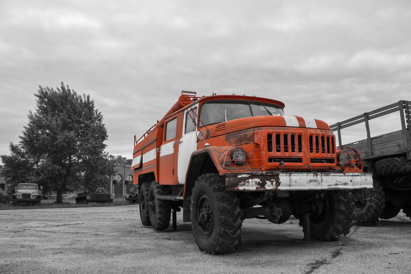 outdoors, red, tree, pick-up truck, cloud - sky, fire truck, tire, wheel, commercial land vehicle, truck, black and white, nature, motor vehicle, ural
