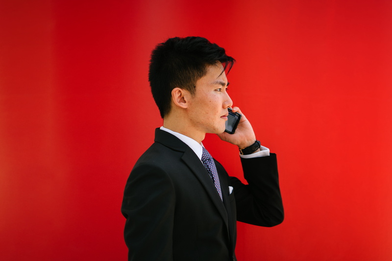 wear, phone call, well-dressed, men, jacket, colored background, studio shot, communication, indoors, holding, red, worried, talking, males, wearing, business