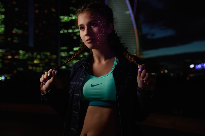 Julia Metlakova, holding hair, sportswear, jacket, belly, braids, brunette, outdoors, city lights, jeans jacket, night, brown eyes, braided hair, women