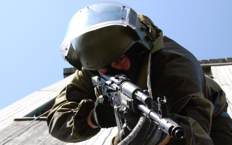 outdoors, uniform, protection, helmet, 1080P, safety, gun, portrait, special forces, one person, soldiers, black, day, real people, ak, aggression, military uniform