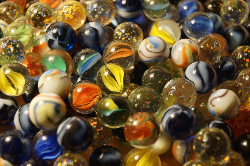 full frame, indoors, no people, photography, art and craft, high angle view, jewelry, close-up, glass marbles, backgrounds, abundance, marble, sphere, semi-precious gem