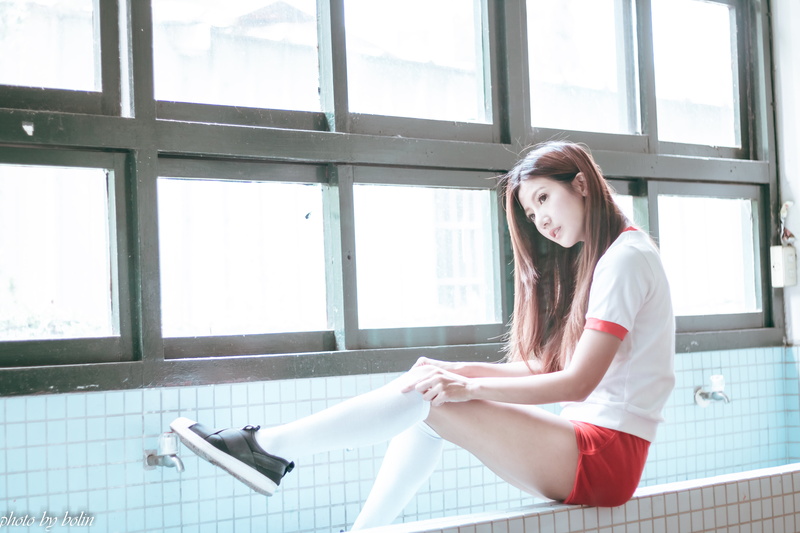 short shorts, portrait, lifestyles, 5K, real people, looking at camera, casual clothing, teenager, Asian, window, White socks, day, sitting, full length