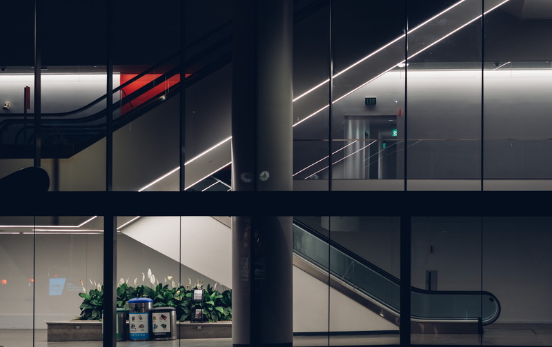 exit, steps and staircases, reflection, indoors, transparent, empty, ceiling, glass - material, escalator, modern, glass, interior, night, illuminated
