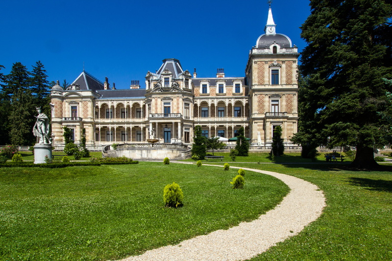 garden path, built structure, green color, outdoors, history, hermes villa, building Exterior, blue, travel destinations, grass, plant, castle, the past