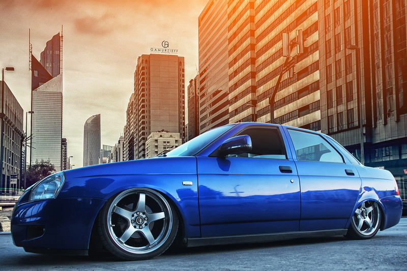 Prior, motor vehicle, city, built Structure, office building exterior, sedan, car, urban Scene, luxury, cityscape, red, sky, land Vehicle, stance, outdoors
