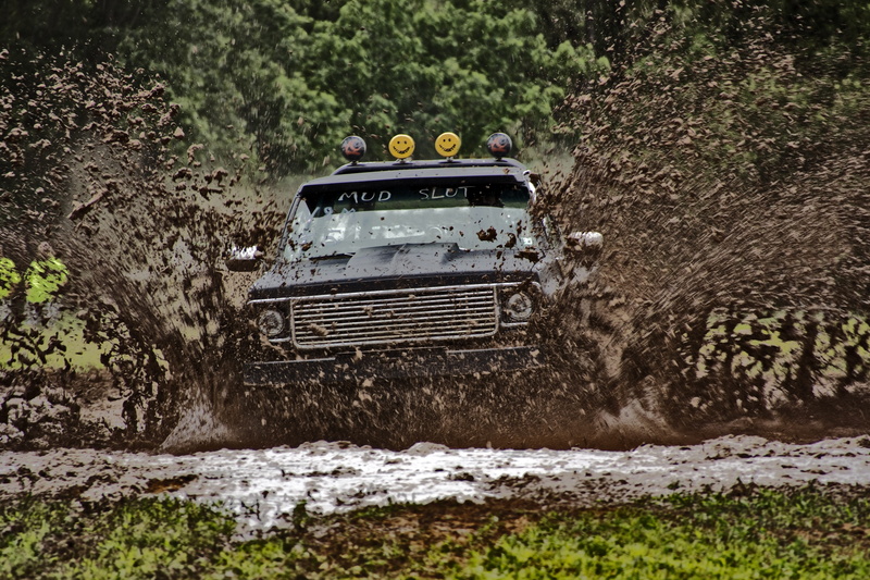 motion, mud bog, sport, truck, motor vehicle, plant, building exterior, land, built structure, architecture, no people, day, race, travel, transportation